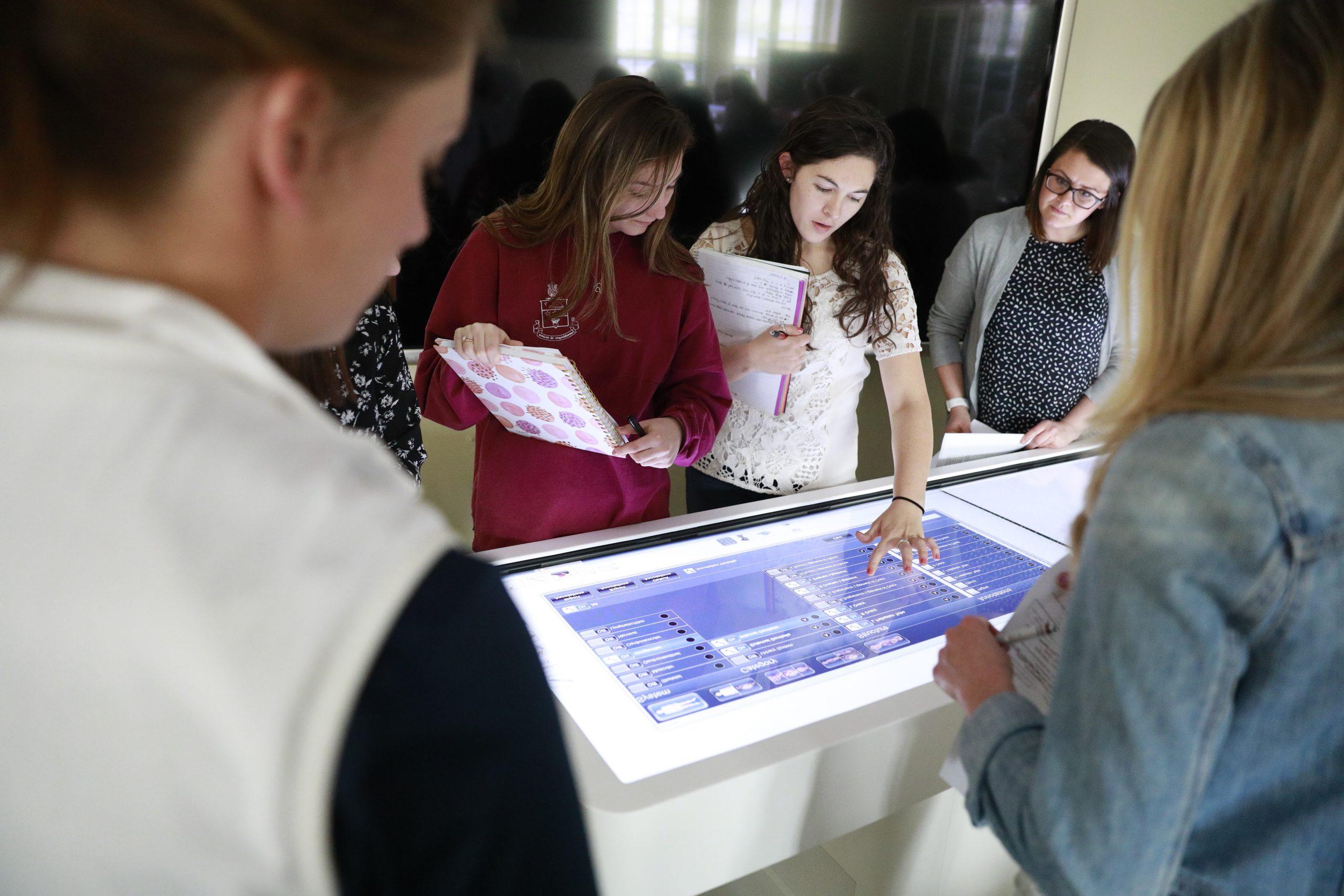 students working on an interactive anatomy screen in lab